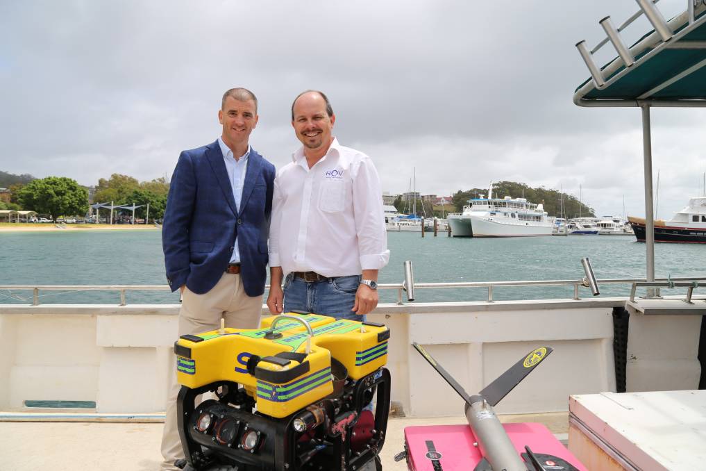 Ed Korber, managing director of Subsea, and Michael Porritt, director of ROV Innovations, with one of the remotely operated underwater vehicles that will be used to locate submerged shipping containers from the YM Efficiency. Picture: Ellie-Marie Watts